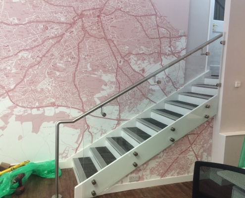 Stainless steel banisters with glass balustrade